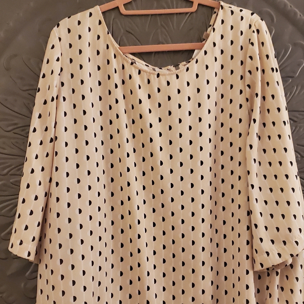 Used.  Color is more cream, black and taupe